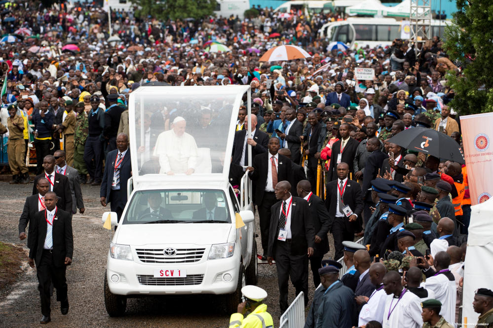 Pope Francis waves as he arrives to celebrate a Mass at the campus of the University of Nairobi, Kenya, on Thursday. 
