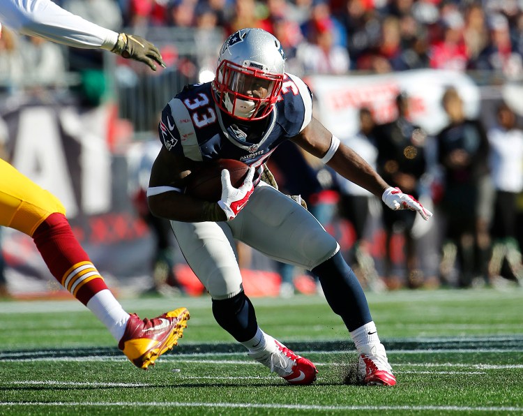 Patriots running back Dion Lewis cuts during the game against Washington in Foxborough on Sunday. The Associated Press