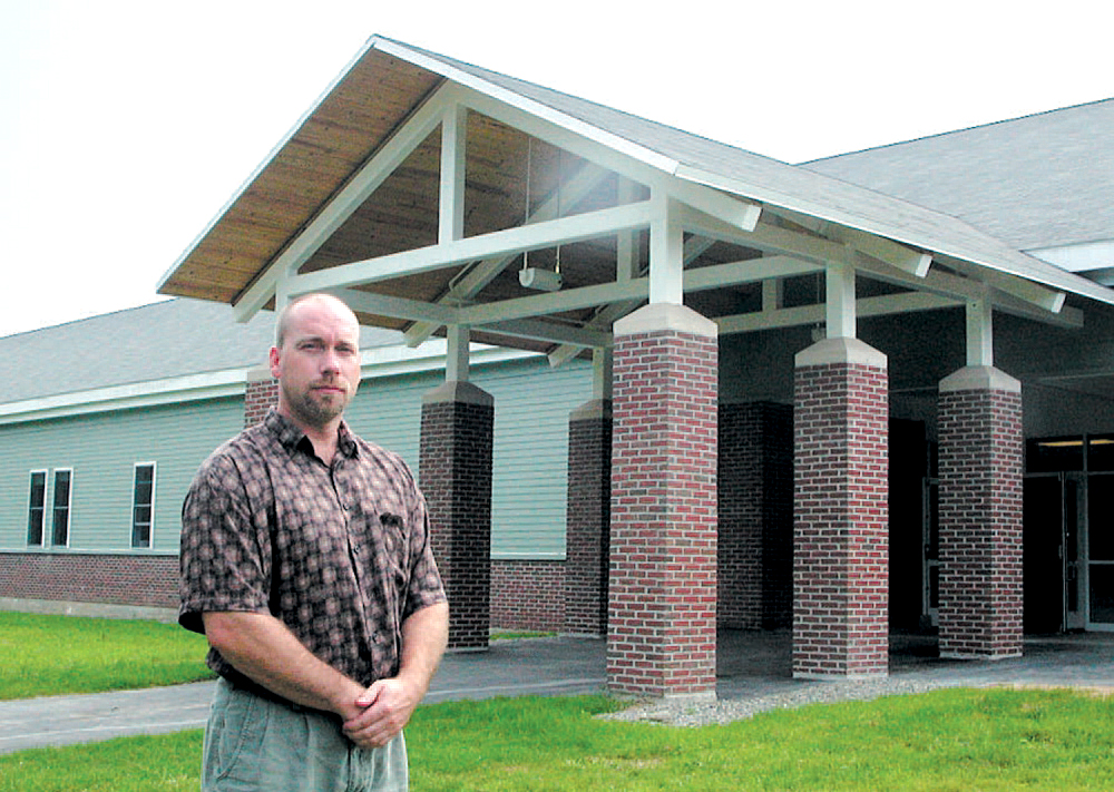 Mt. Blue Middle School Principal Gary Oswald stands outside the school building after a major renovation in 2003. Oswald has announced he will retire at the end of this school year after 30 years at the school, 18 as principal.