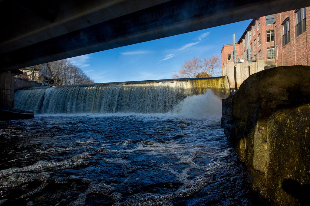 Water flows over the Kesslen Dam in downtown Kennebunk on Monday. Removing the Kesslen Dam and two others would allow the lower 9 miles of the Mousam River to flow freely.
Gabe Souza/Staff Photographer