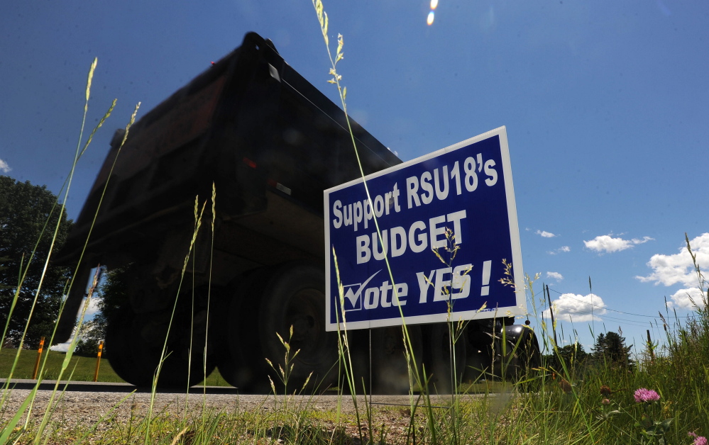 A Regional School Unit 18 campaign budget sign is seen on Oakland Road in North Belgrade last June. School officials intend to keep residents in the district informed early about this year’s budget process in hopes of keeping it from becoming as fractious as it has in recent years.