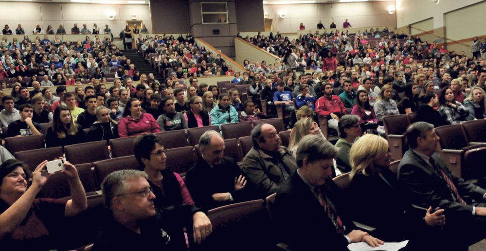 Messalonskee High School students and staff and state officials listen as Paula Callan received the Assistant Principal of the Year award on Thursday.