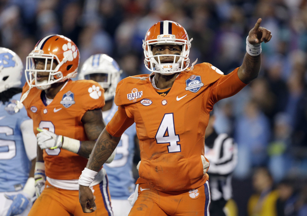 Clemson’s Deshaun Watson celebrates his touchdown against North Carolina in Saturday’s Atlantic Coast Conference championship game in Charlotte, North Carolina, on Saturday. Clemson finished the top seed and will play Oklahoma in the semifinals of the College Football Playoff on New Year’s Eve.