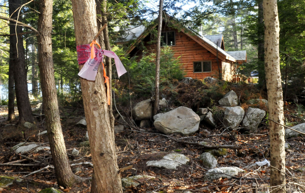 A ribbon on a tree is a boundary marker for the proposed site of a summer camp on Long Pond in Rome. Several residents of the area are opposed to the camp, and a local attorney has told selectmen that applying the town’s commercial noise ordinance to the camp may be difficult.