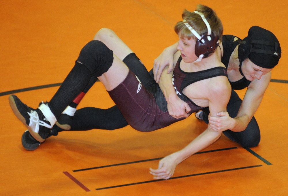 Nokomis’ Josh Brown, left,  and Monmouth’s Emily Levasseur compete in the 113-pound championship match at the Tiger Invitational last season. Brown won the title and will be back to try and defend it on Saturday.