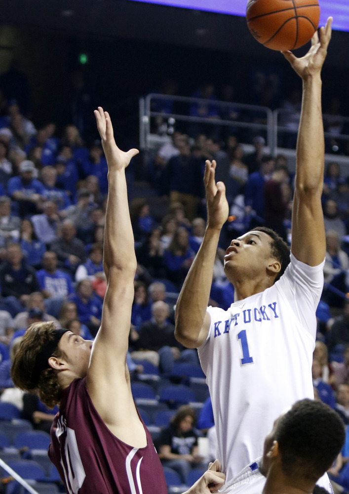 Kentucky’s Skal Labissiere (1) shoots over Eastern Kentucky forward and former Messalonskee standout Nick Mayo during the first half of a game Wednesday in Lexington, Kentucky. Mayo finished with nine points.