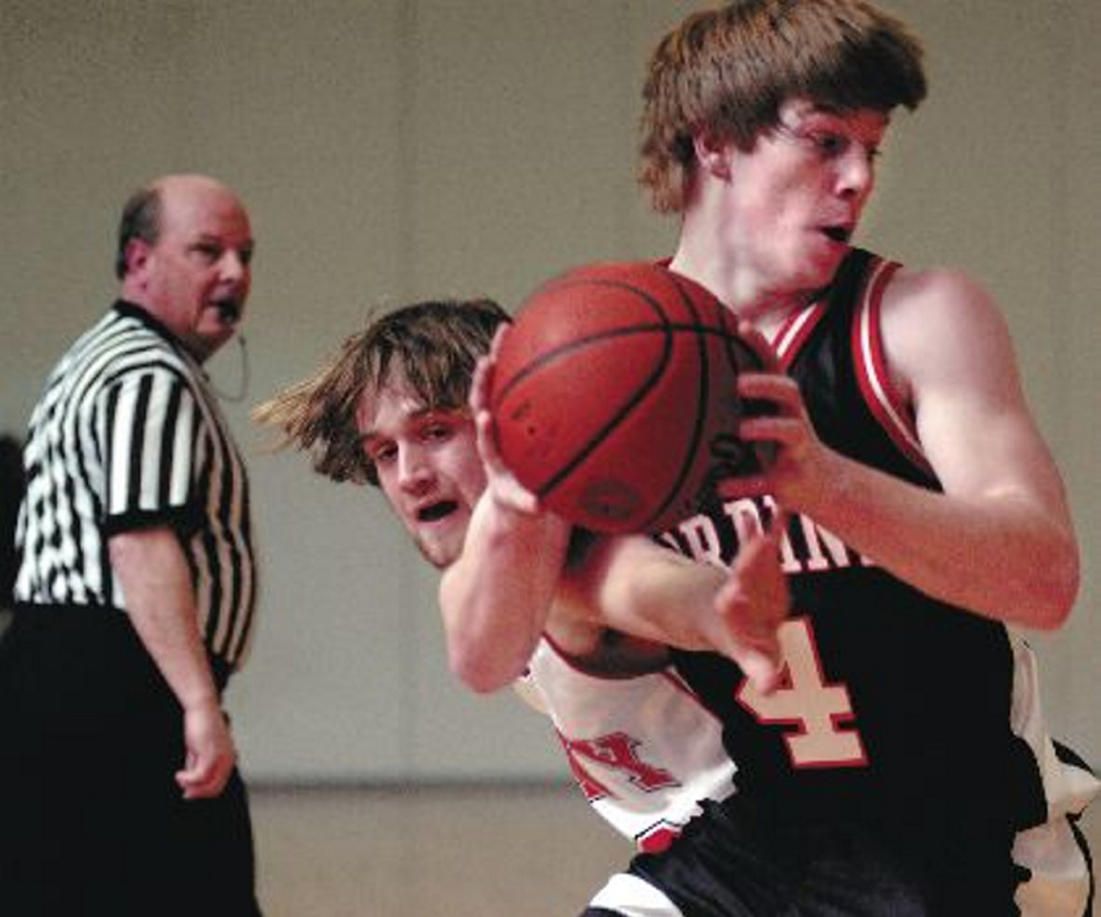 Gardiner Area High School’s Kyle Stilphen looks for an opening around Cony High School’s John DeMerchant during a game in the 2007. It was the last regular-season game between the two teams.