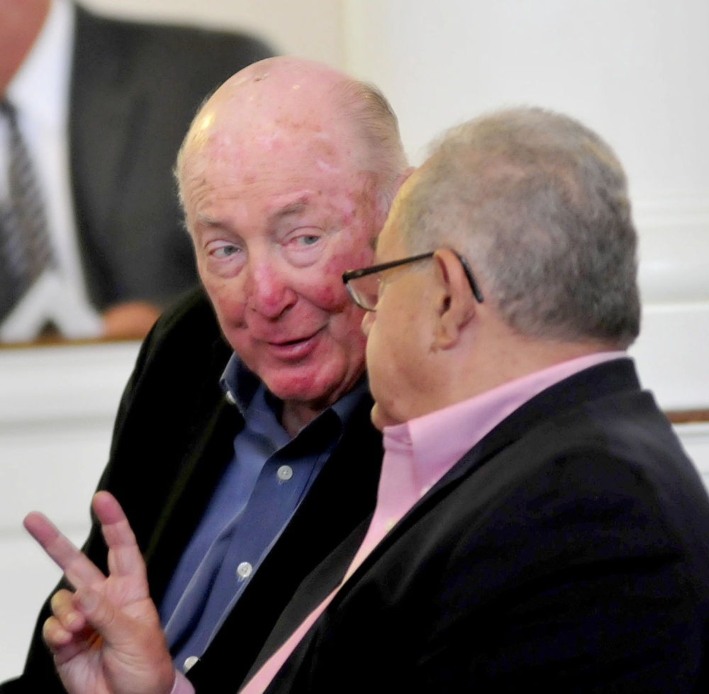 In this Aug. 17, 2014 photo, U.S. Hockey Hall of Fame coach Jack Kelley, left, speaks with an attendee of a memorial service for former baseball coach John Winkin Jr. held at Colby College. It was announced Thursday that Kelley will be one of 11 inductees in the class of 2016 for the Maine Sports Hall of Fame.