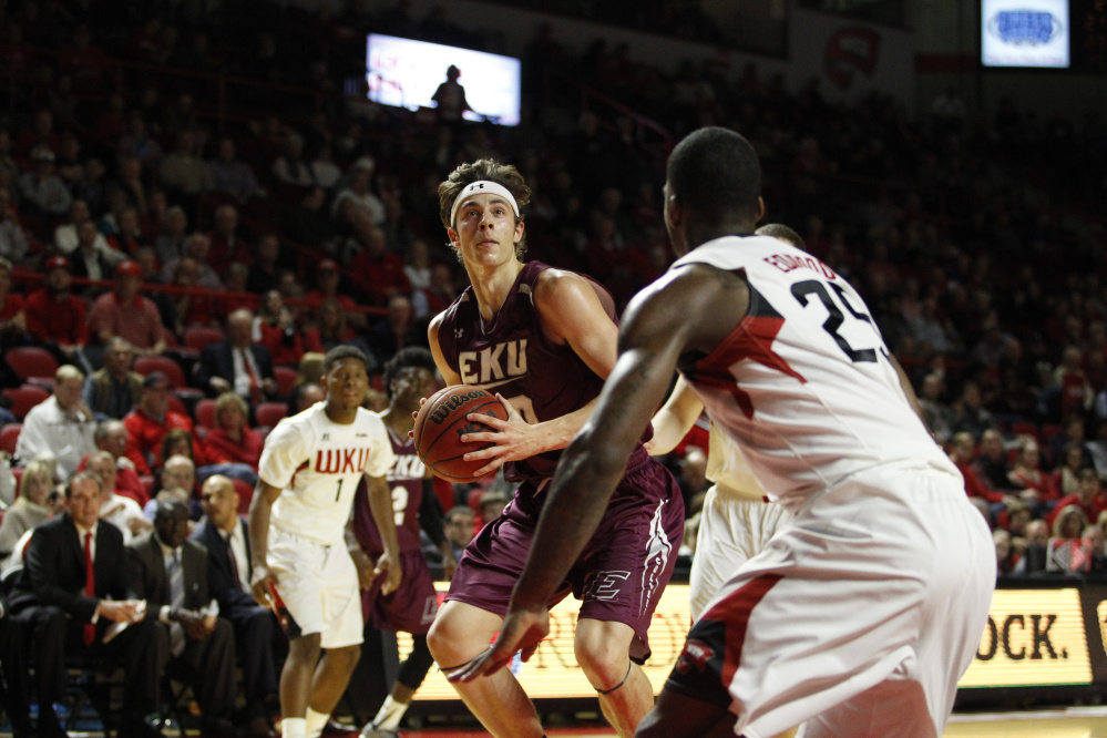 Eastern Kentucky forward Nick Mayo, left, looks for a shot during a Dec. 1 game against Western Kentucky.