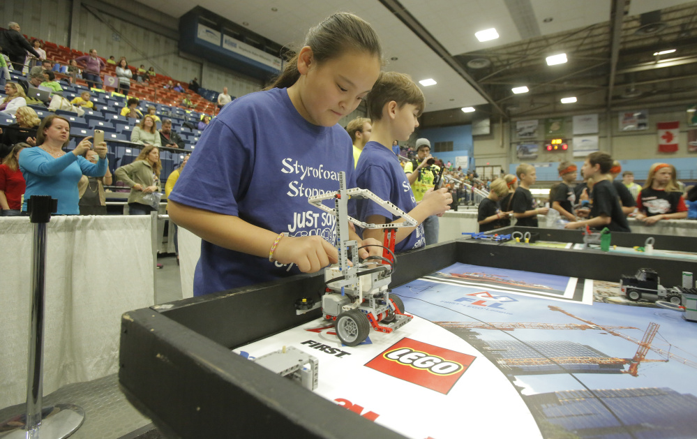 MinGe Daley, a fifth-grader at Sea Road School in Kennebunk, waits to start her team’s robot Saturday in the third round of competition at the Maine FIRST LEGO League State Championship at the Augusta Civic Center. Sixty teams from around the state competed in the championship.