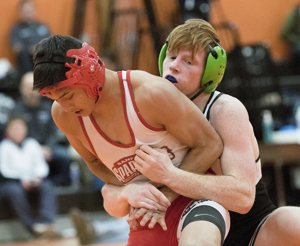 Gardiner’s Peter Del Gallo, right, takes on Kwan Chheans in the 126-pound finals in the Tiger Invitational on Saturday in Gardiner. Del Gallo won the title.