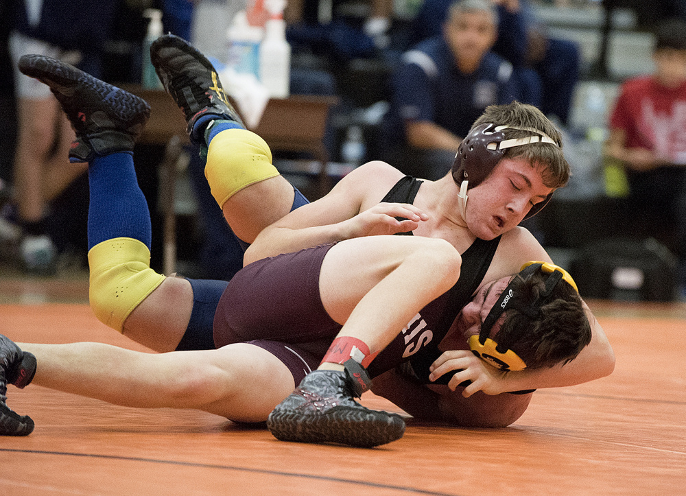 Nokomis’ Quinton Richards, top, deals defeat to Morse’s Isaiah Cogswell during final round action in the 138-pound division in the Tiger Invitational on Saturday in Gardiner.