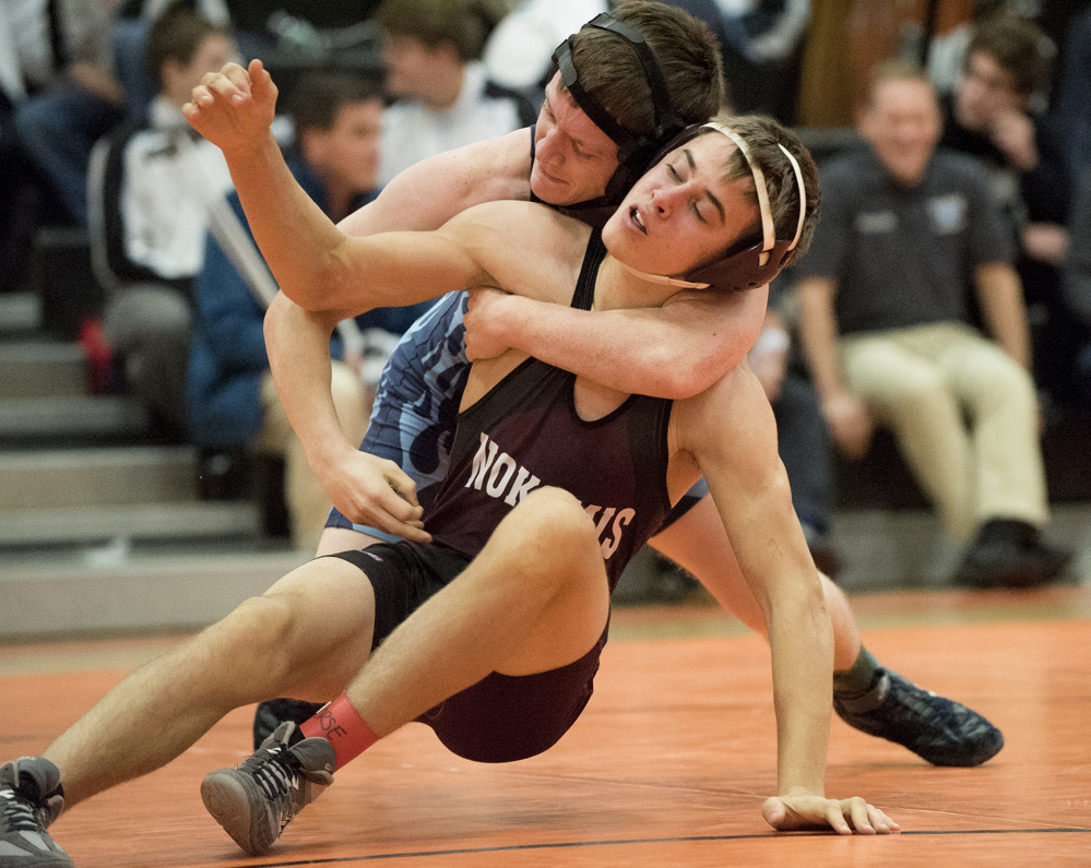 Nokomis’ David Wilson, right, takes on and defeats Portland’s Kyle Hansen during 152-pound semifinal action in the Tiger Invitational onSaturday at Gardiner High School.