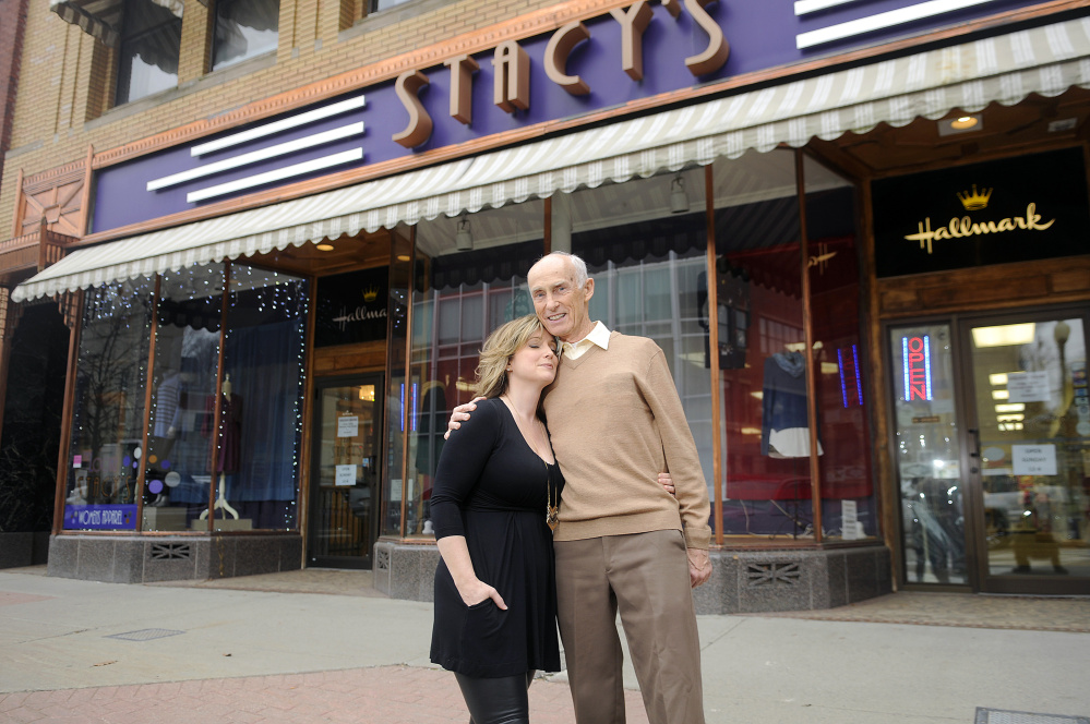 Stacy Gervais and her father, Richard Cummings, outside of their Augusta business on Monday. Stacy’s Hallmark is closing after more than four decades on Water Street.