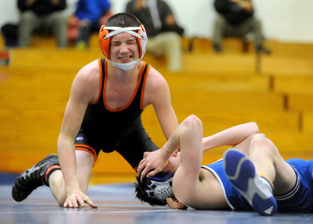 Skowhegan’s Samson Sirois, left, and Erskine’s Cam Grass, react after they wrestled in a 120-pound class bout last season in South China. Sirois is wrestling in the 132-pound class this season.