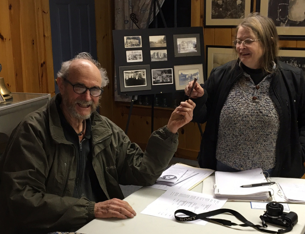 Rodney Porter, left, retiring president of the Western Maine Blacksmith Association, accepts a wrought iron nail as a token of appreciation from Janine Winn, club treasurer.