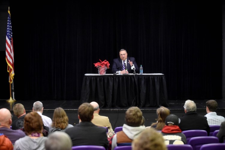 Gov. Paul LePage speaks to people assembled Thursday at Waterville Junior High School for a town hall meeting.