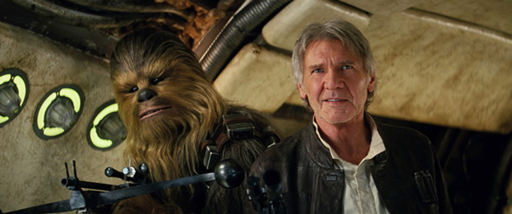Peter Mayhew as Chewbacca and Harrison Ford as Han Solo in “Star Wars: The Force Awakens.” Studio estimates on Sunday say “Star Wars: The Force Awakens” brought in a galactic $238 million over the weekend, making it the biggest North American debut of all time.