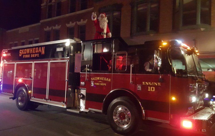 Santa Claus rides into Skowhegan earlier this month on Engine 10,t he town’s new firetruck. The truck was delivered just in time for the annual Holiday Stroll Dec. 5.
