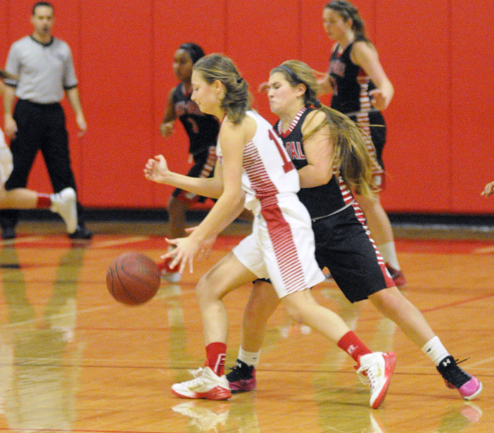 Cony’s Haley Ward, left, is defended by Hall-Dale’s Emma Begin during the Chrisanne Burns Memorial Tournament last month at Cony High in Augusta. Ward has played strong for the young Rams this season.