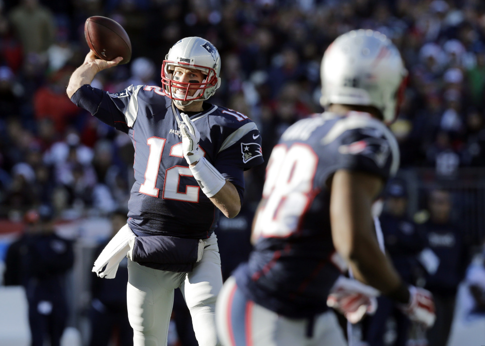 New England Patriots quarterback Tom Brady (12) passes to running back James White (28) in the first half against the Tennessee Titans on Sunday in Foxborough, Mass. Brady and the Patriots will take on the New York Jets on Sunday.