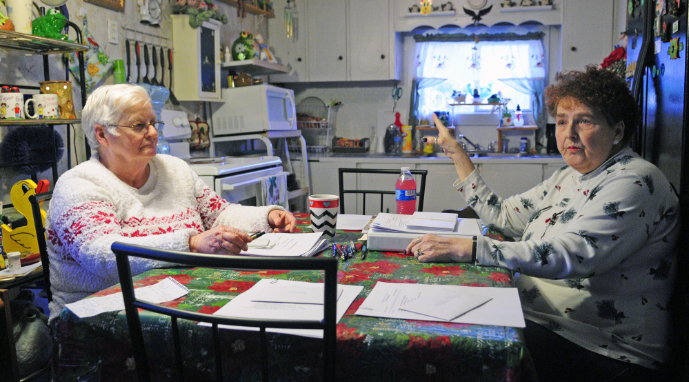 Treasurer Gertrude Turcotte, left, and Secretary Beverly Chase talk about the board’s plans for the park on Dec. 15 at Deer Ridge Mobile Home Park in Augusta.