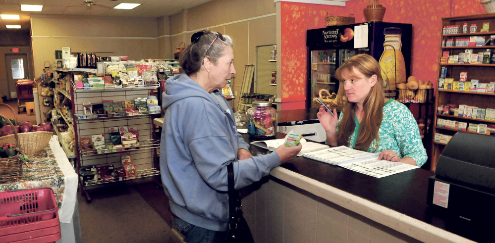 Ginny Jewell, right, owner of Ginny’s Natural Corner, waits on customer Irene Quirion at the 78 Water St. store in October. Jewell is one of four finalists in the Entrepreneur Challenge sponsored by Main Street Skowhegan and Skowhegan Savings Bank.