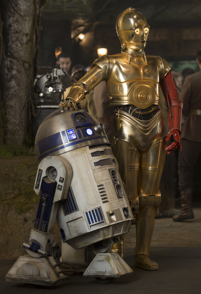 R2-D2, left, and C-3PO share a scene from the new film, “Star Wars: The Force Awakens.”
