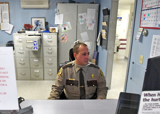 Deputy John Morris, with the Madison division of the Somerset County Sheriff’s Office, works the desk on Thursday, Dec. 23. The Madison Police Department was absorbed by the Somerset County Sheriff’s office in June 2015.