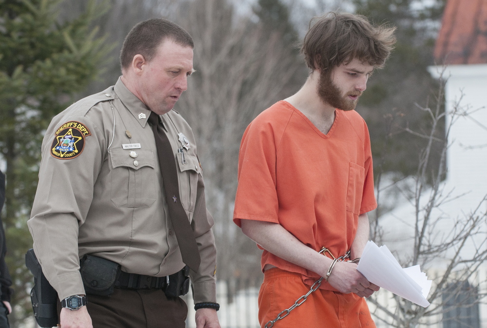 Dana Craney, right, is escorted to a waiting jail transport by Franklin County Sheriff’s Department deputy Walter Fail after Carney’s initial appearance in Franklin County Superior Court in Farmington on Dec. 23, 2014. Craney was in court in connection with the death of his grandmother Joanne Goudreau.