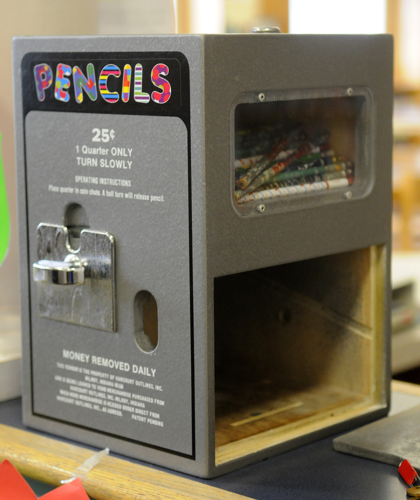 Coins were reported stolen from a pencil dispenser Monday after the door on it was smashed at the Carrie Ricker School library.