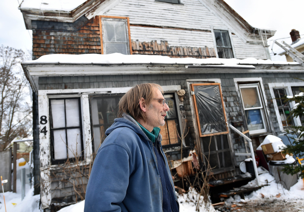 Robert Von Husen, stands in front of his Pine Street duplex in Madison on Thursday after a fire damaged part of the porch in the early morning hours. The fire was spotted by two Canadian truck drivers who passed by the home after delivering their loads to Madison Paper. Von Husen was at work at the time the fire was spotted and would like to extend a thank-you to the truck drivers, who left without giving their names, who put out the fire with snow and saving his home and family.
