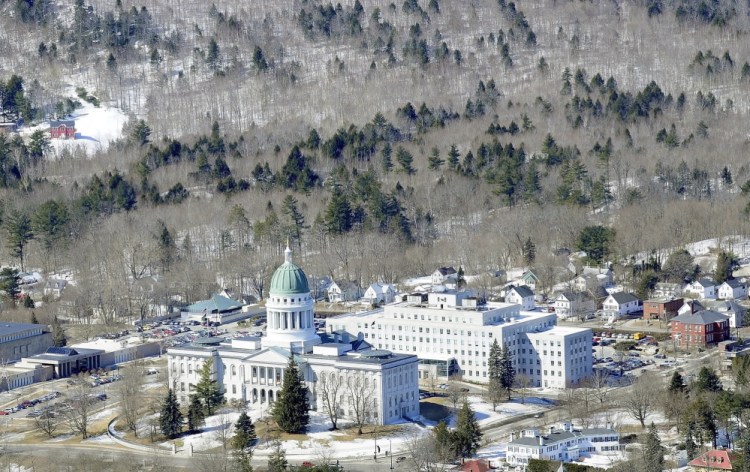 This aerial photo taken in March 2014 shows Howard Hill, 164 acres that form a forested backdrop for the Maine State House. Gov. Paul LePage's administration is asking the Land for Maine’s Future board to review new appraisals for Howard Hill, Clapboard Island in Falmouth and Kittery’s Brave Boat Headwaters.