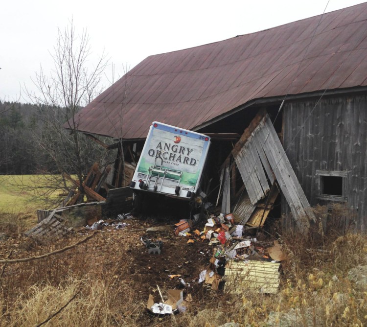 Police say this Angry Orchard truck was stolen from a Portland convenience store and spotted by a York County deputy before it crashed into a barn in Limerick.