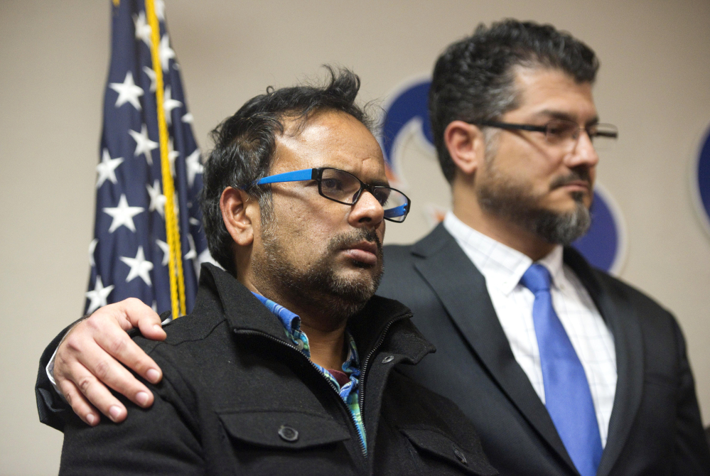 Farhan Khan, left, brother-in-law of one of the suspects in Wednesday’s shooting,  and Hussam Ayloush of the Council on American-Islamic Relations hold a news conference Wednesday in Anaheim, Calif. Khan said he had no idea what might have motivated the attackers. Nevertheless, the San Bernardino killings are likely to trigger a backlash against American Muslims.