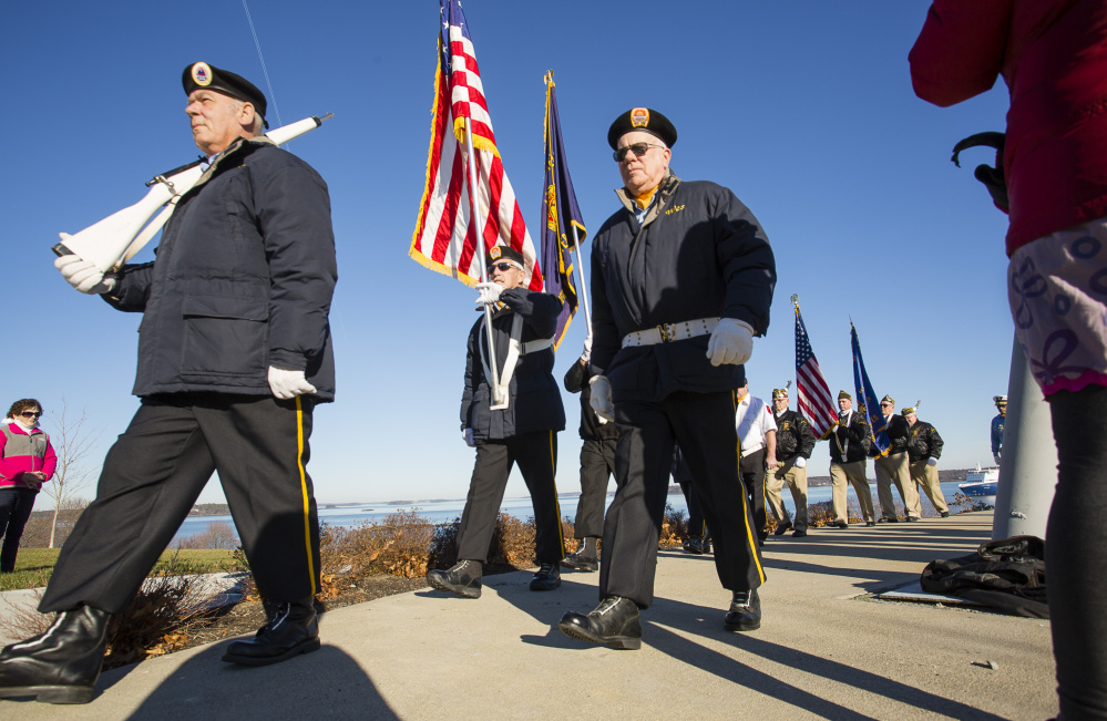 Members of the Amvets Post 6 Color Guard march away at the end of last year's Pearl Harbor remembrance service at Fort Allen Park in Portland.
