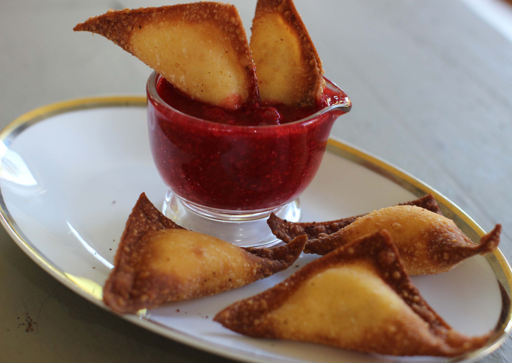 Fried sweet cheese and almond dumplings – basically blintzes in wonton wrappers – with raspberry sauce.
