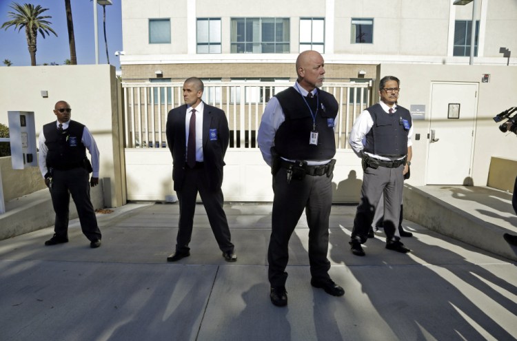 Security is tight after Enrique Marquez’s arrival Thursday at U.S. District Court in Riverside, Calif. Marquez, a longtime friend of Syed Farook, was charged with conspiring with Farook in 2011 and 2012 to commit terrorism, and with illegally buying two assault rifles that Farook and Tashfeen Malik used in the San Bernardino massacre Dec. 2.