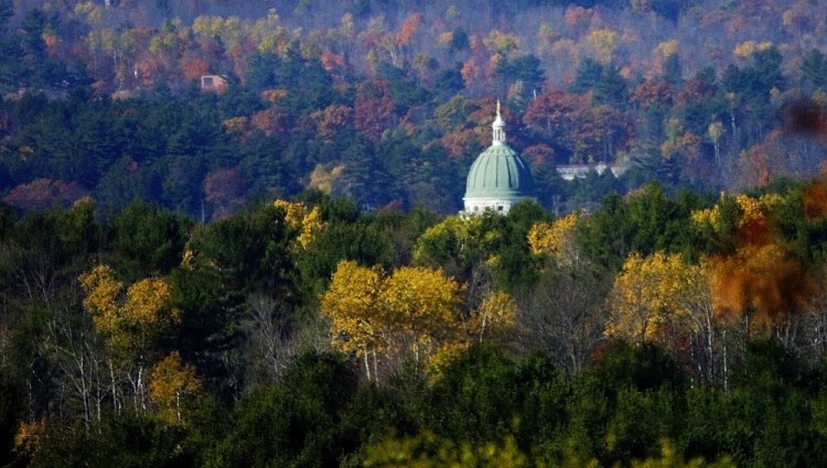 Howard Hill looms in this view of the State House from Route 17 in Augusta. An effort to preserve the 164-acre tract for public use is in line to receive $337,500 in taxpayer funds as part of the Land for Maine’s Future program.