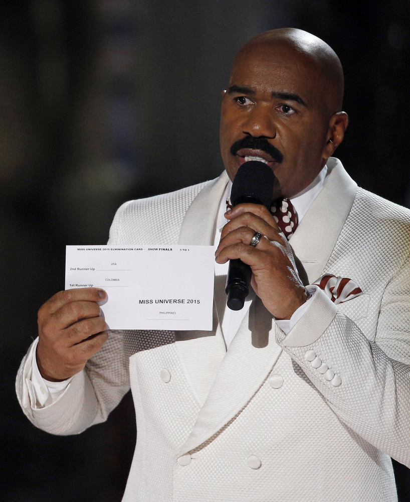 Steve Harvey holds the card showing the winners’ names after he crowned the wrong contestant Miss Universe at Sunday’s pageant. Miss Philippines took the title.