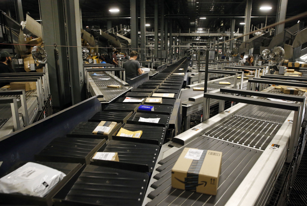 Parcels make their way along some of Worldport’s 155 miles of conveyor belts in Louisville, Ky.