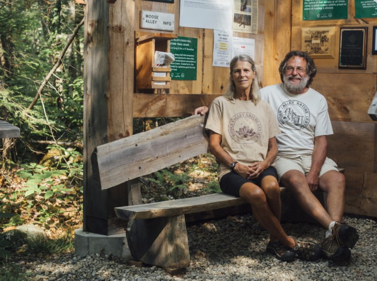 Bambi Jones and her husband, Tracy Moskovitz, sit inside the Hidden Valley Nature Center. This fall, Hidden Valley merged with three other land-protection groups to form the Midcoast Conservancy.