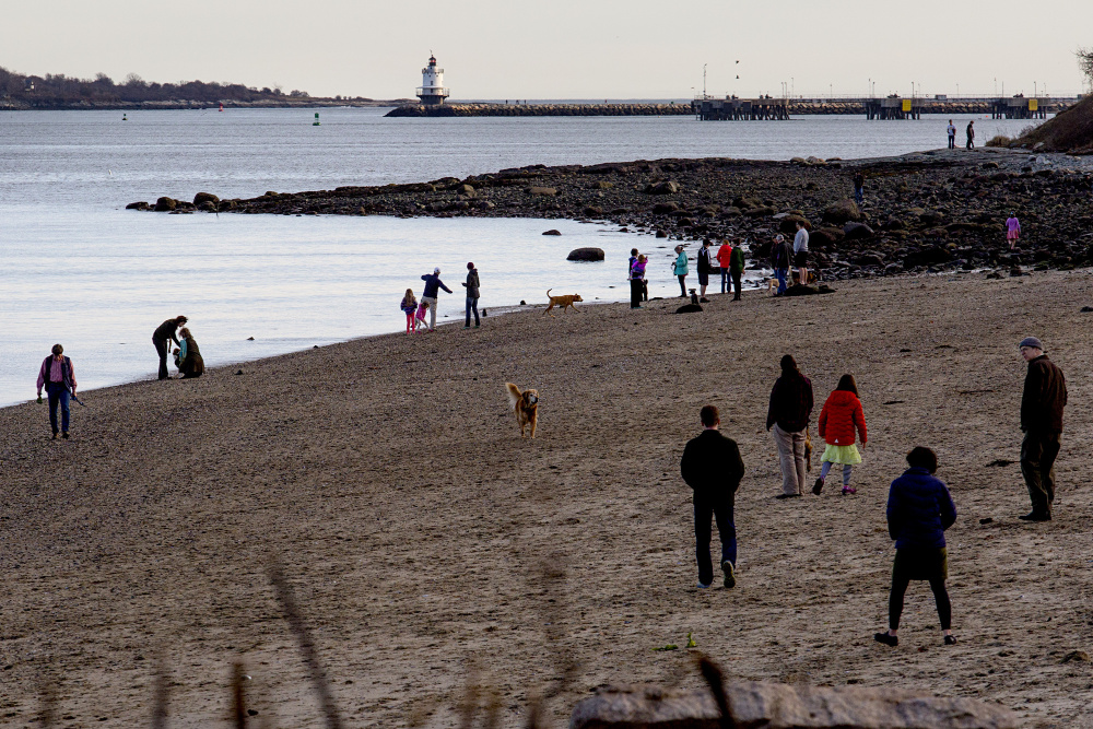 Portland's East End Beach was a popular place on Christmas, a day of record-setting warmth in over Maine.