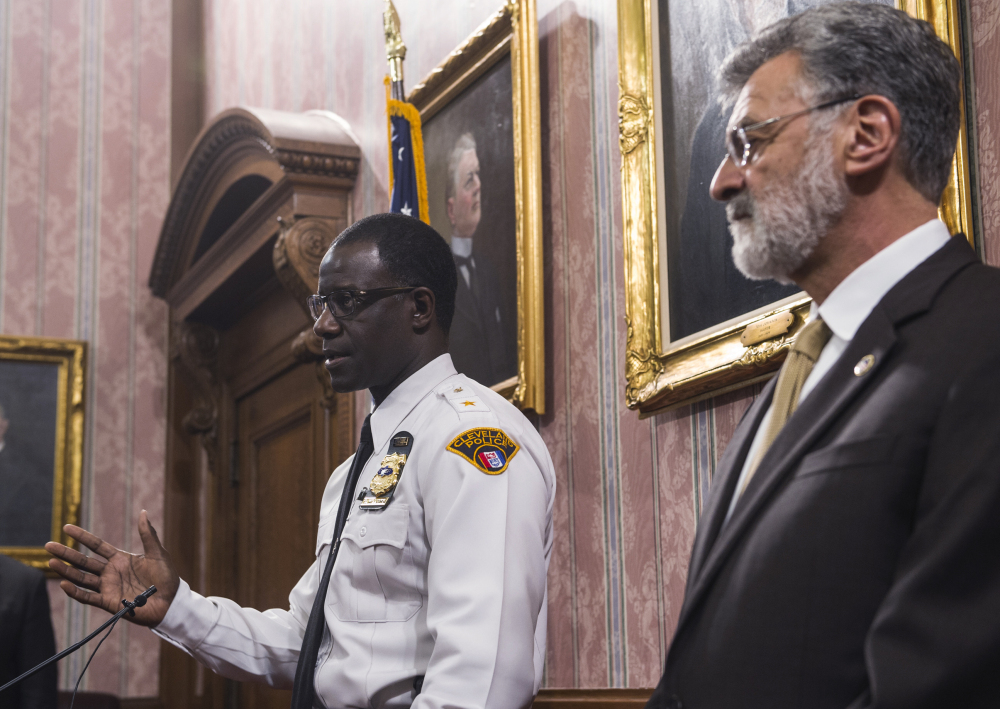 Cleveland Police Chief Calvin Williams answers questions as Mayor Frank Jackson watches during a news conference Monday after a Cuyahoga County grand jury decided not to indict Cleveland police officer Timothy Loehman in the shooting death of 12-year-old Tamir Rice. Jackson said the city and the police department plan an internal review that could lead to discipline against the two officers who were involved.