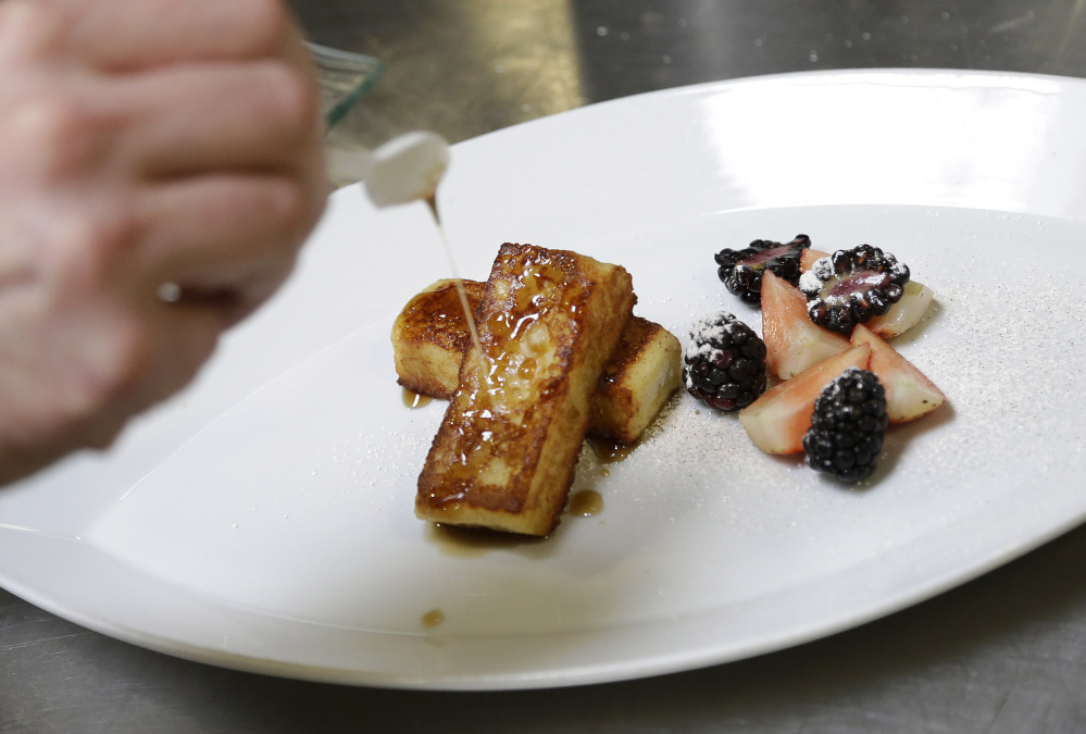 Hampton Creek Foods pastry chef Ben Roche pouring syrup over french toast made with Just Scramble. In trying to appeal to the mainstream, co-founder and CEO Josh Tetrick has a simple rule. “Number one, never use the word ‘vegan,’ ” he said.