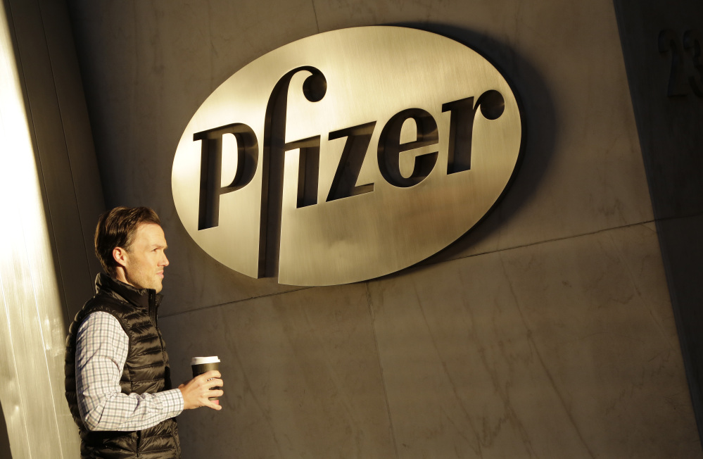 A man enters Pfizer’s world headquarters in New York. 