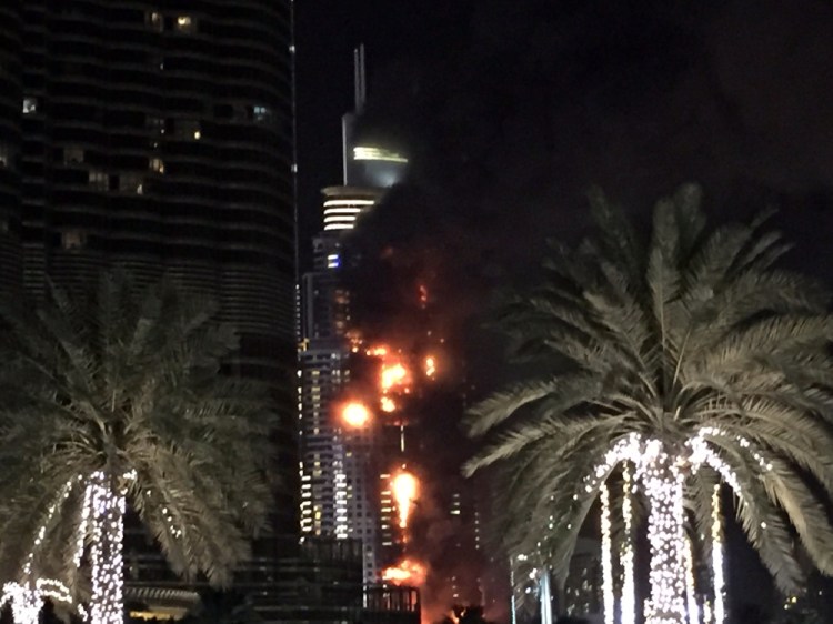 A fire runs up some 20 stories of a building in Dubai, United Arab Emirates, on Thursday. It was not immediately clear what caused the fire.