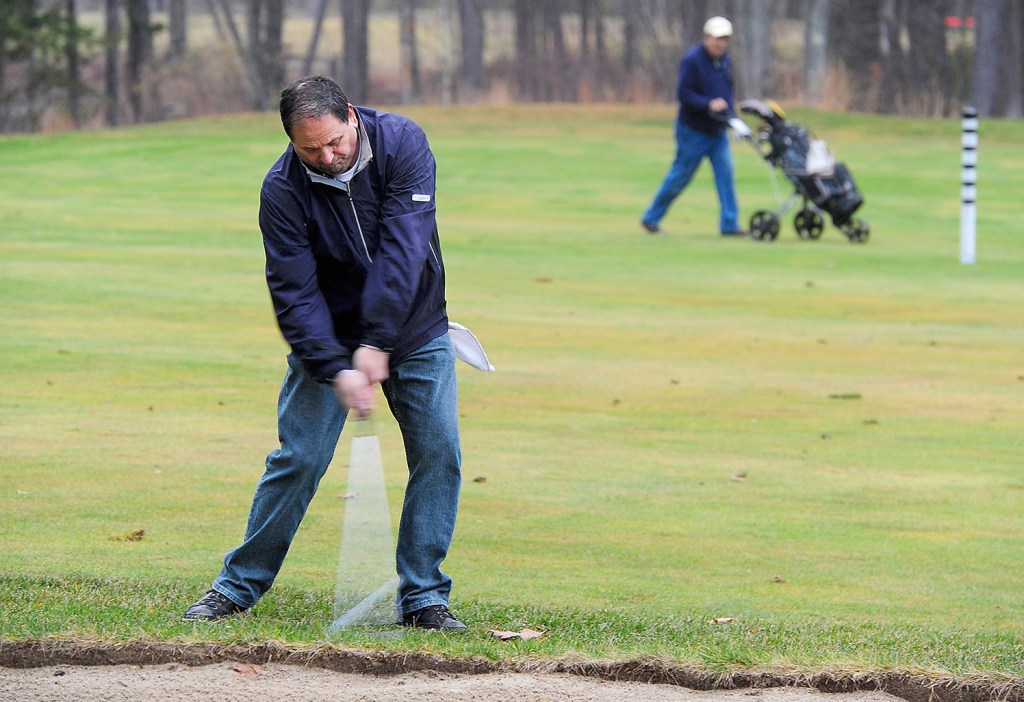 Danny Valliere of Biddeford plays a round of golf Monday at Nonesuch River Golf Course in Scarborough, which drew more than 100 golfers each day this weekend.
Gordon Chibroski/Staff Photographer