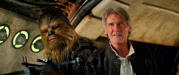This photo provided by Lucasfilm shows Peter Mayhew as Chewbacca and Harrison Ford as Han Solo in "Star Wars: The Force Awakens." The movie opens in U.S. theaters on Dec. 18.