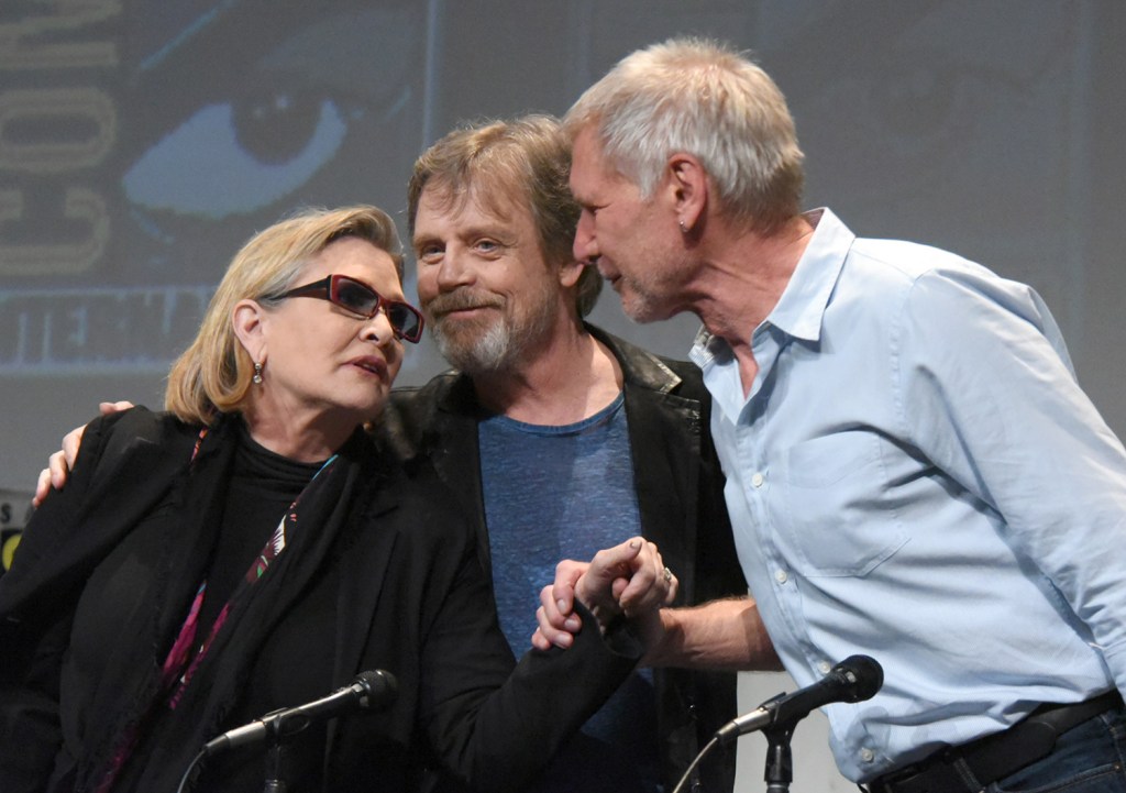 Carrie Fisher, Mark Hamill, and Harrison Ford attend Lucasfilm's "Star Wars: The Force Awakens" panel on day 2 of July's Comic-Con International in San Diego, Calif. 